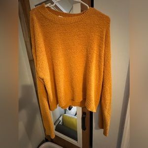 Yellow sweater.